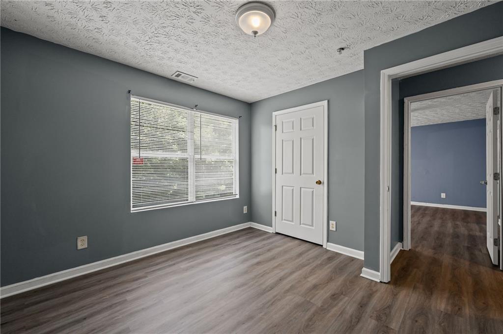 3303 Par 3 Way Lithonia, GA 30038 - Photo 19 of 27 a view of livingroom with hardwood floor and window