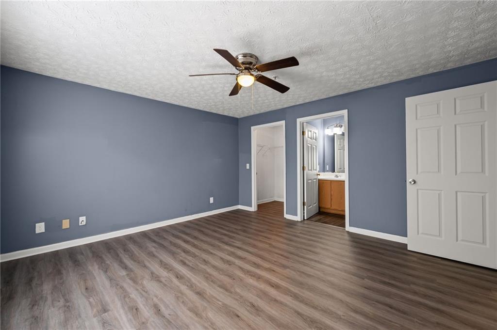 3303 Par 3 Way Lithonia, GA 30038 - Photo 23 of 27 a view of an empty room with window and wooden floor