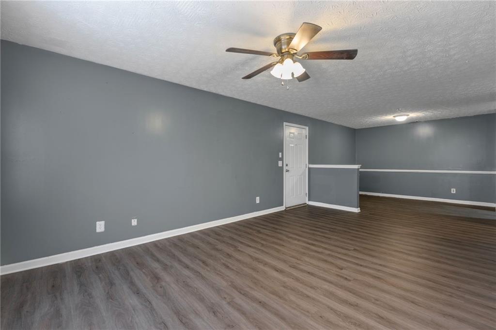 3303 Par 3 Way Lithonia, GA 30038 - Photo 5 of 27 a view of an empty room with wooden floor