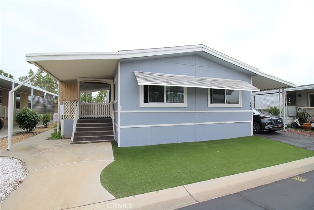 4000 Pierce Street, Unit 325 Riverside, CA 92505 - Photo 1 of 1 a front view of a house with a garden and yard