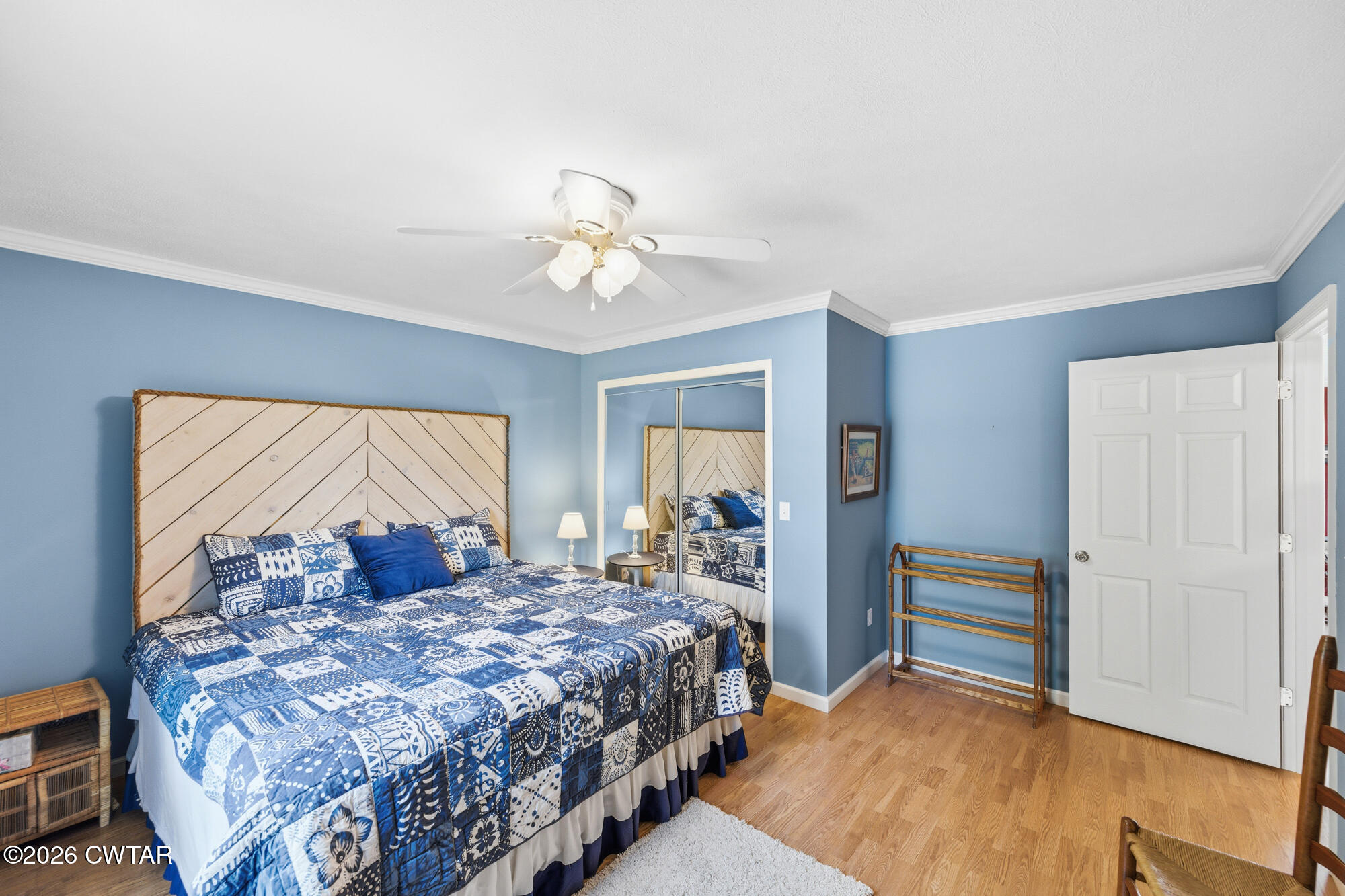 1728 Yarbro Landing Lane Decaturville, TN 38329 - Photo 12 of 44 a bedroom with a large bed and a chandelier