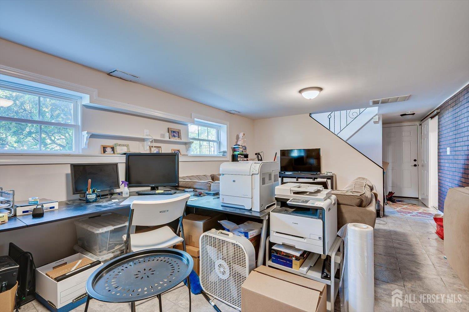 12 Gales Road Edison, NJ 08837 - Photo 25 of 35 a work room with furniture a flat screen tv and a window