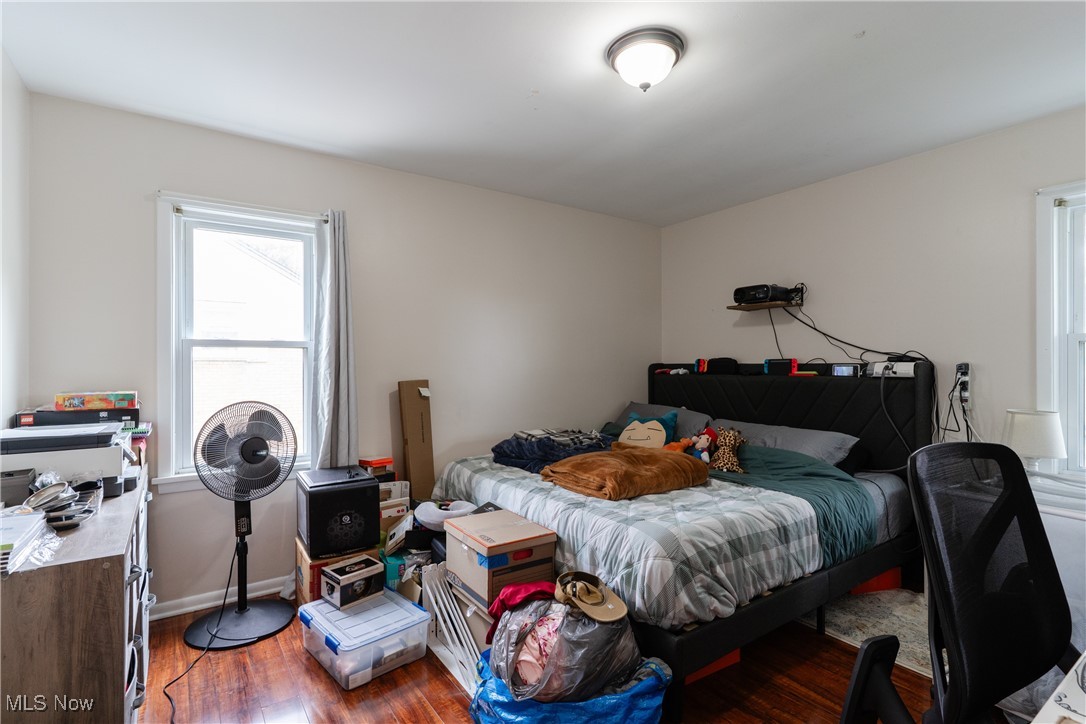 14220 Triskett Road Cleveland, OH 44111 - Photo 26 of 32 Bedroom featuring wood finished floors and baseboards