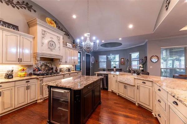 a kitchen with a stove top oven sink and cabinets