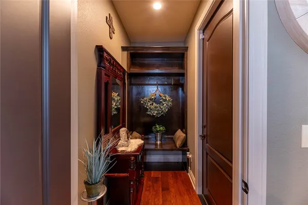 a dining room with furniture and wooden floor