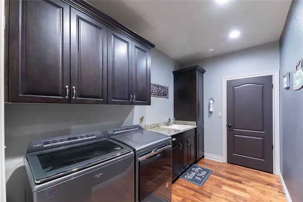 a kitchen with a refrigerator stove and cabinets