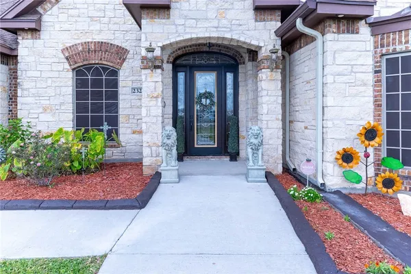 a front view of a house with a garage