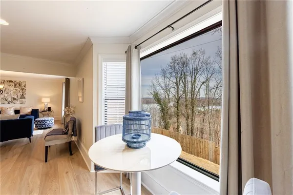 a bedroom with bed tv and window