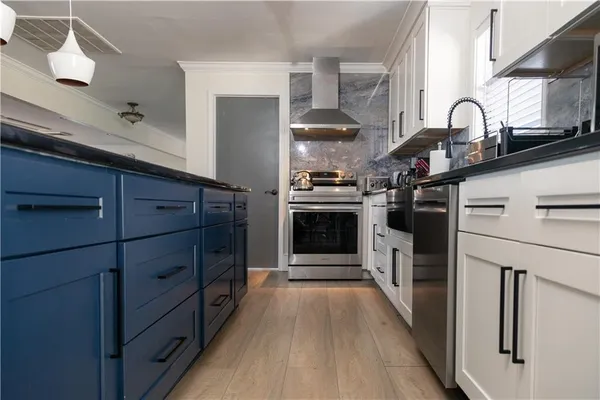 a bathroom with a granite countertop toilet and a shower