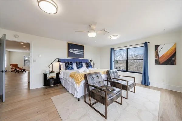 a bathroom with a shower a toilet and sink