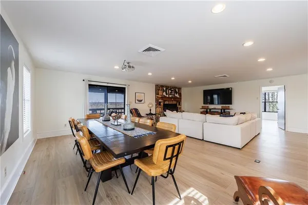 a view of a deck with a table and chairs