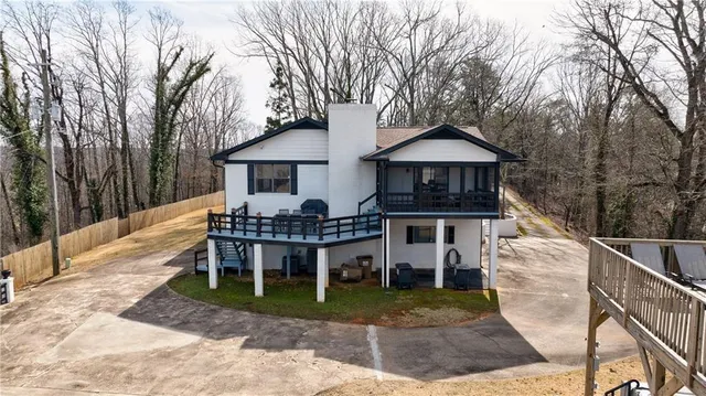 a front view of a house with yard and porch