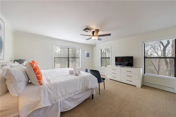 a aerial view of a house with a yard and lake view