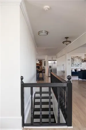 a view of a balcony with wooden floor and city view