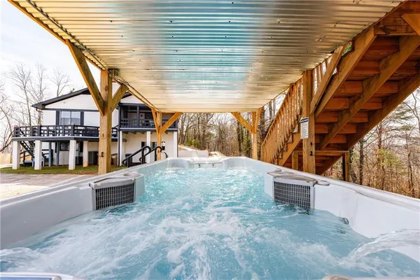 a view of a balcony with wooden floor and fence