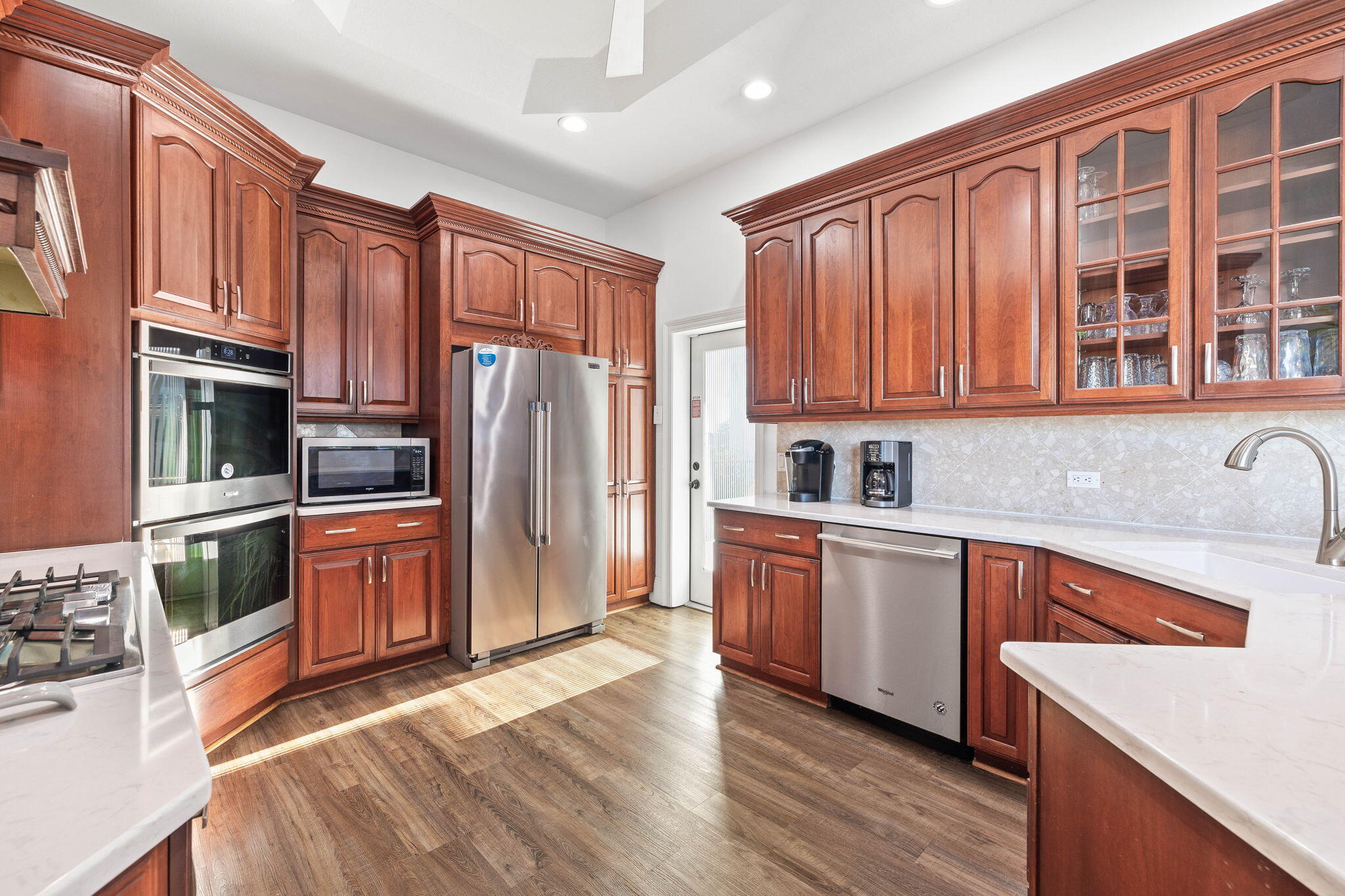 9 St Barts Bay Destin, FL 32541 - Photo 18 of 33 a kitchen with stainless steel appliances granite countertop a refrigerator stove top oven and sink