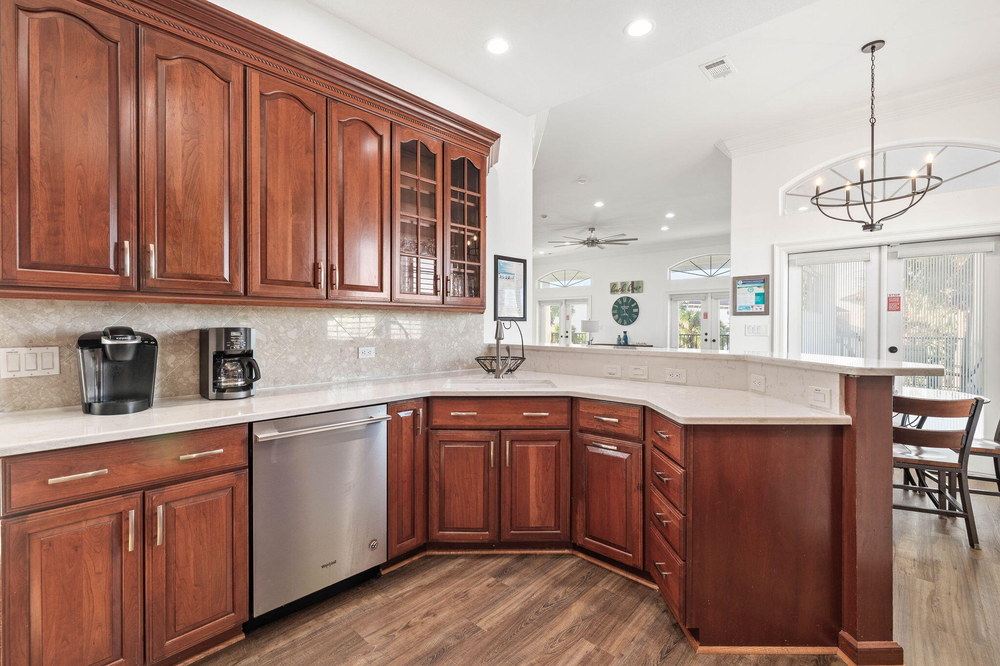 9 St Barts Bay Destin, FL 32541 - Photo 19 of 33 a kitchen with stainless steel appliances granite countertop wooden cabinets a sink and dishwasher