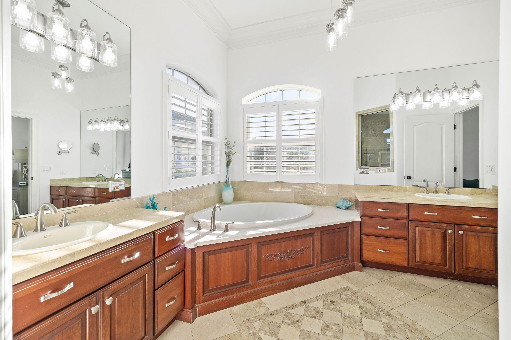 9 St Barts Bay Destin, FL 32541 - Photo 22 of 33 a spacious bathroom with a tub sink and mirror