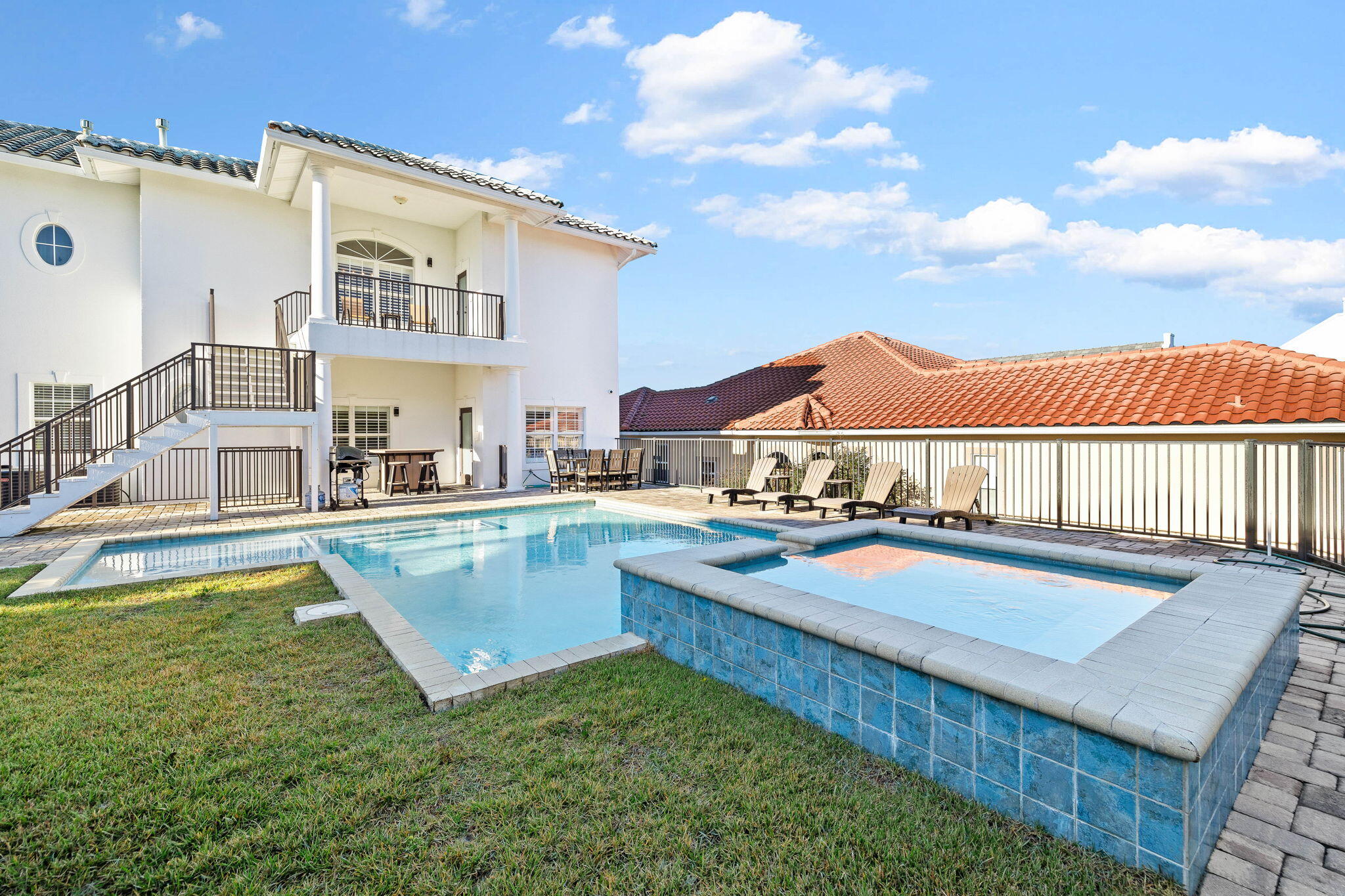 9 St Barts Bay Destin, FL 32541 - Photo 26 of 33 a view of a house with pool and chairs