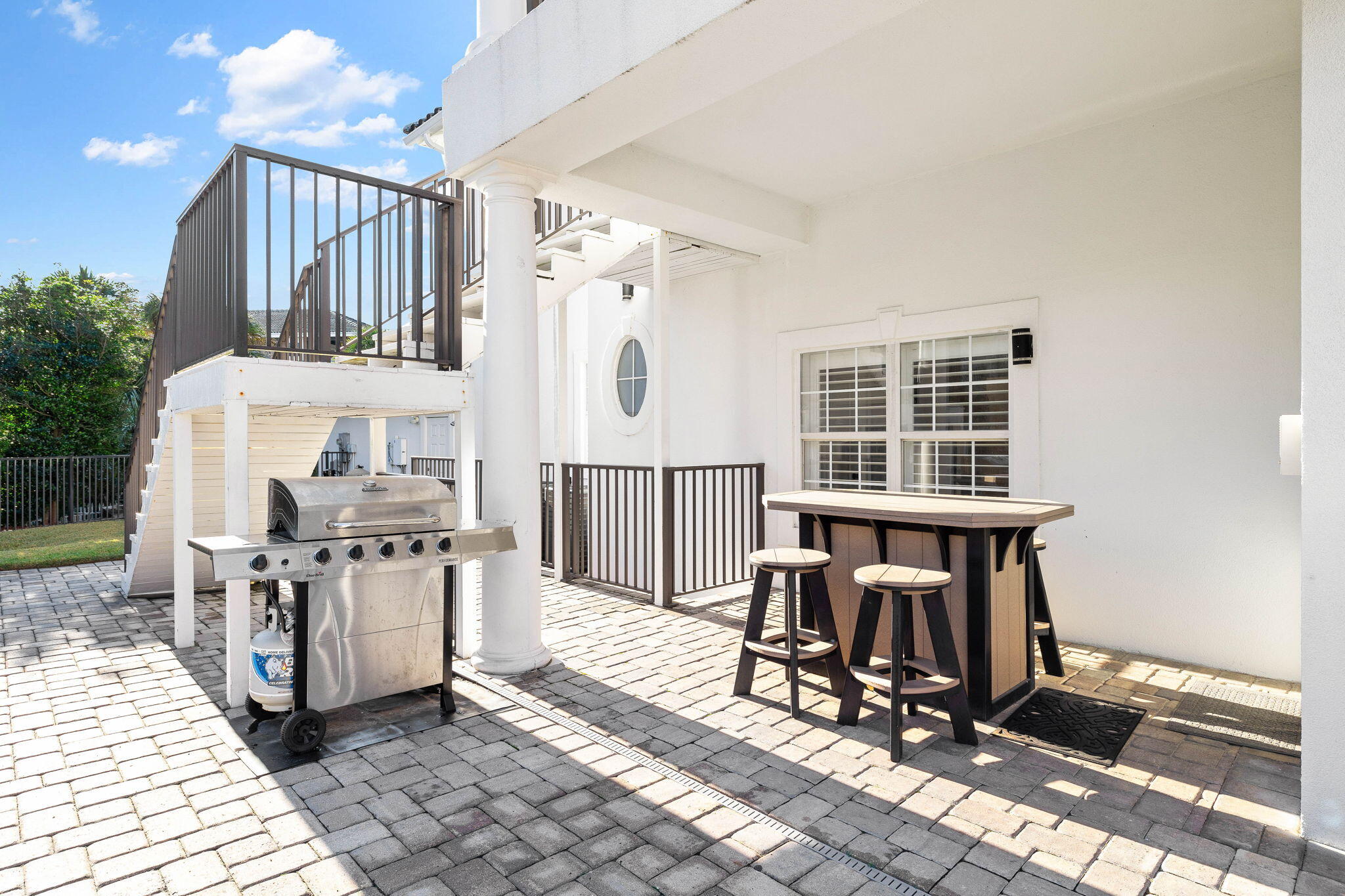 9 St Barts Bay Destin, FL 32541 - Photo 27 of 33 a view of a chairs and table in a back yard of the house