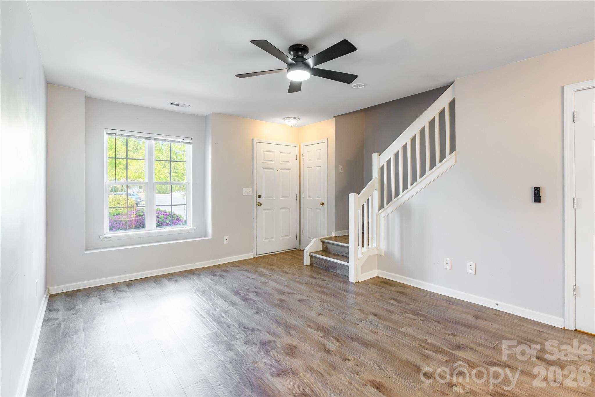 4024 Ashby Lane Fort Mill, SC 29707 - Photo 4 of 21 wooden floor in an empty room with a window