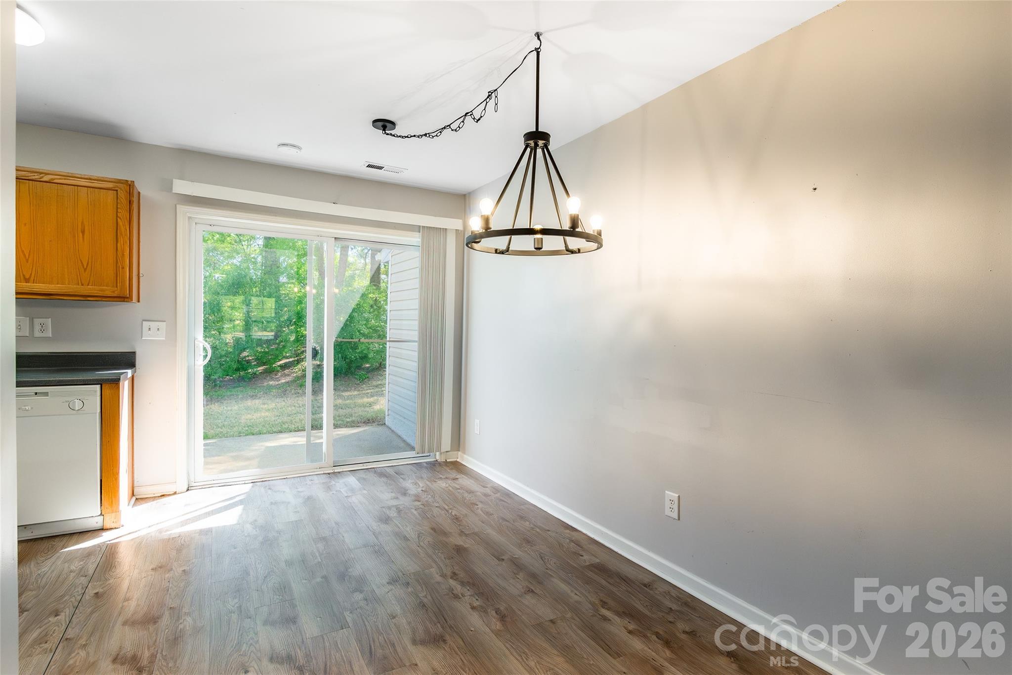 4024 Ashby Lane Fort Mill, SC 29707 - Photo 5 of 21 a view of empty room with wooden floor and fan