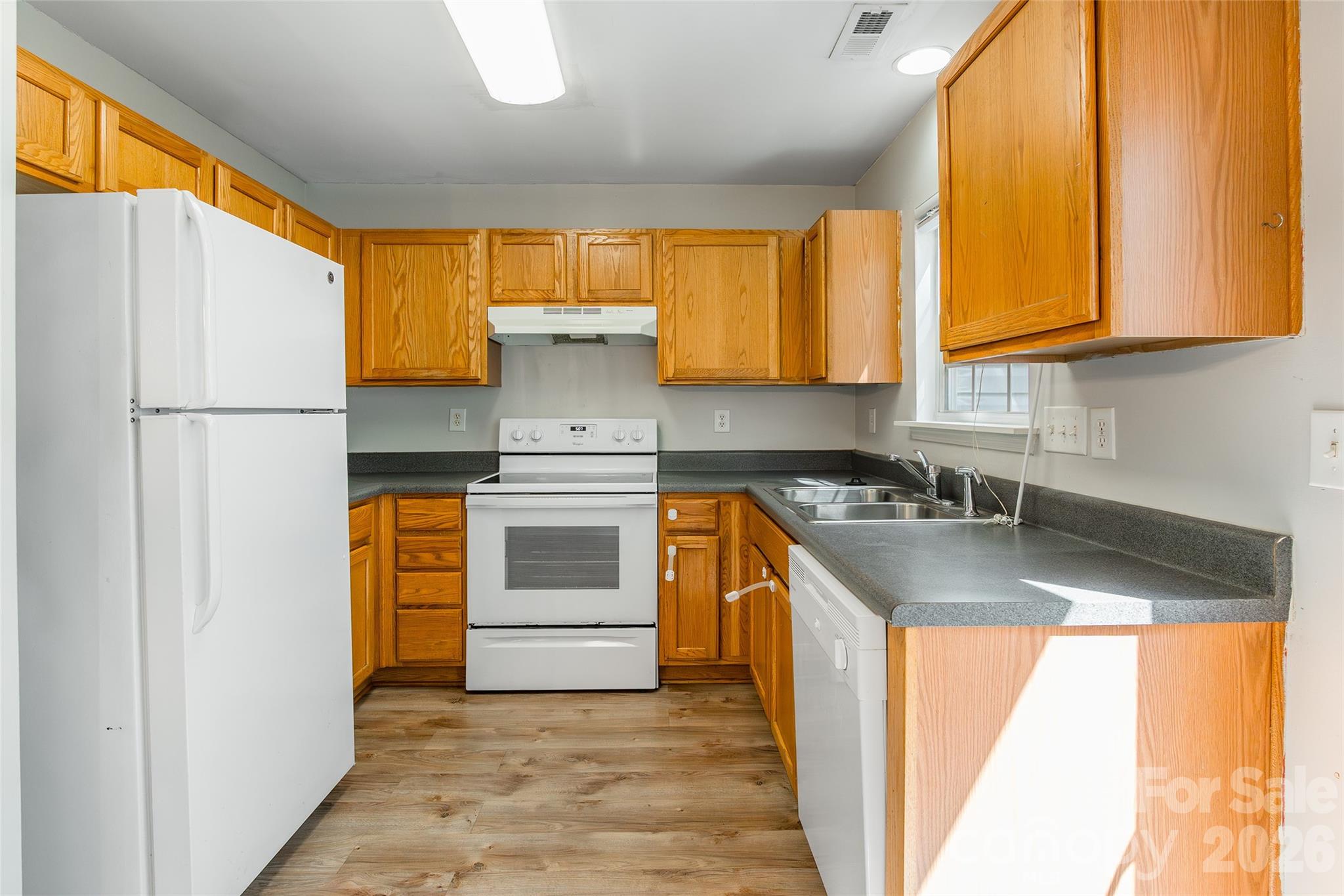 4024 Ashby Lane Fort Mill, SC 29707 - Photo 7 of 21 a kitchen with a sink a stove and refrigerator