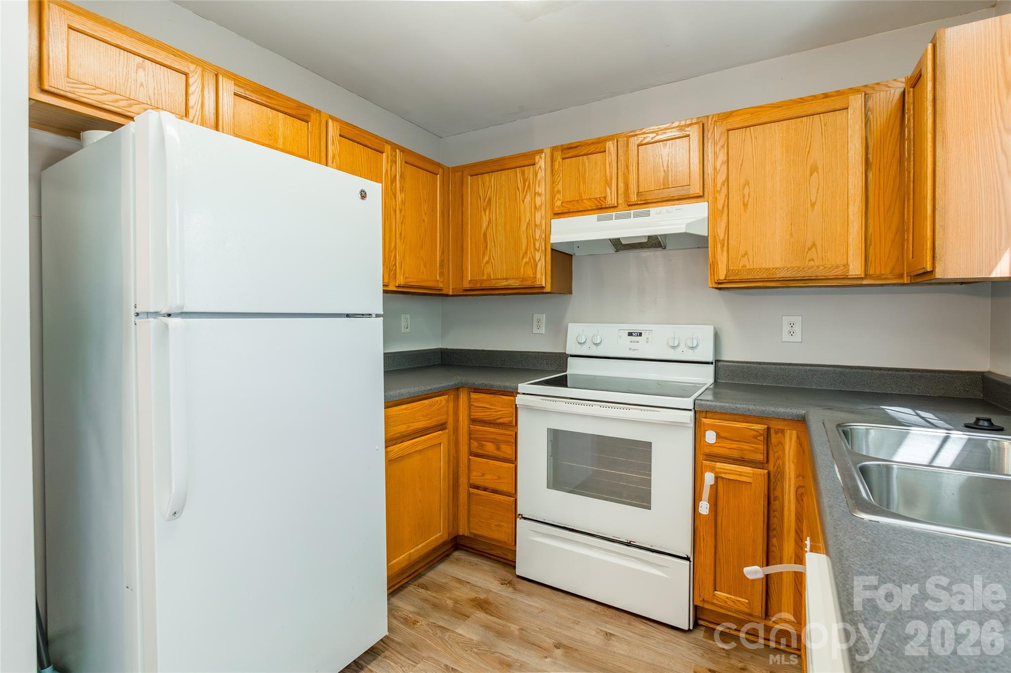 4024 Ashby Lane Fort Mill, SC 29707 - Photo 9 of 21 a kitchen with a refrigerator sink and cabinets