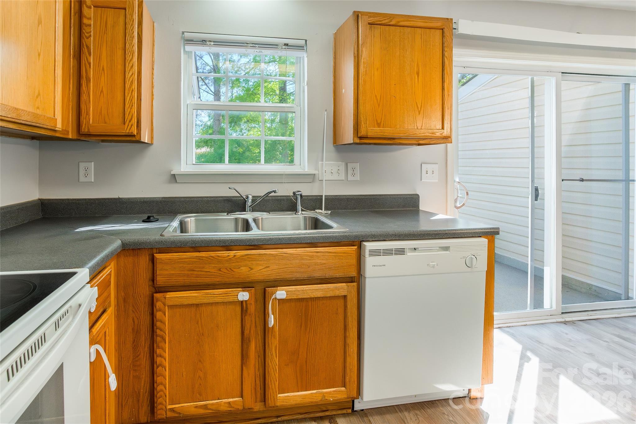 4024 Ashby Lane Fort Mill, SC 29707 - Photo 10 of 21 a kitchen with granite countertop cabinets and large window