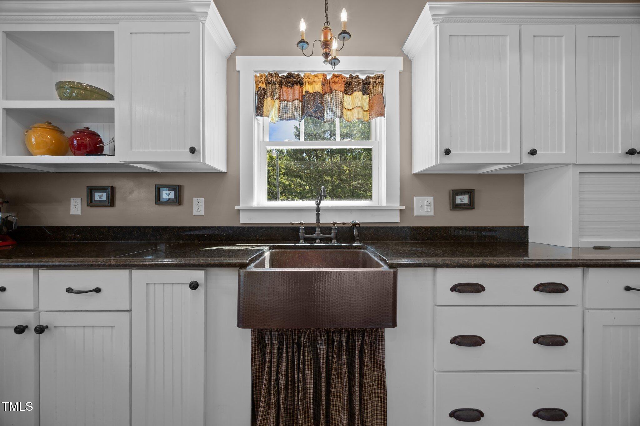 4050 Culbreth Road Stem, NC 27581 - Photo 21 of 46 a kitchen with stainless steel appliances a cabinets a stove and a window