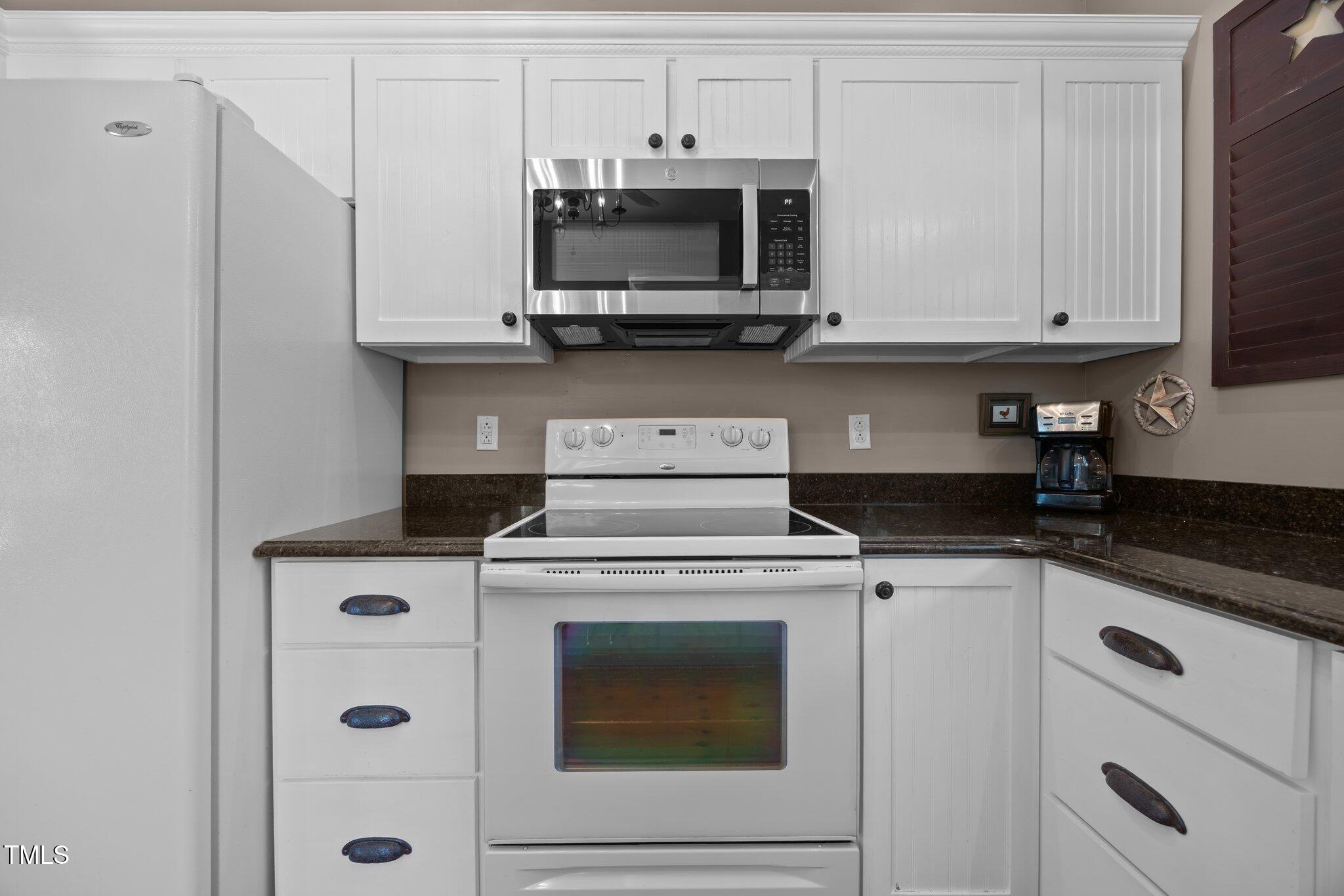 4050 Culbreth Road Stem, NC 27581 - Photo 22 of 46 a stove top oven sitting inside of a kitchen