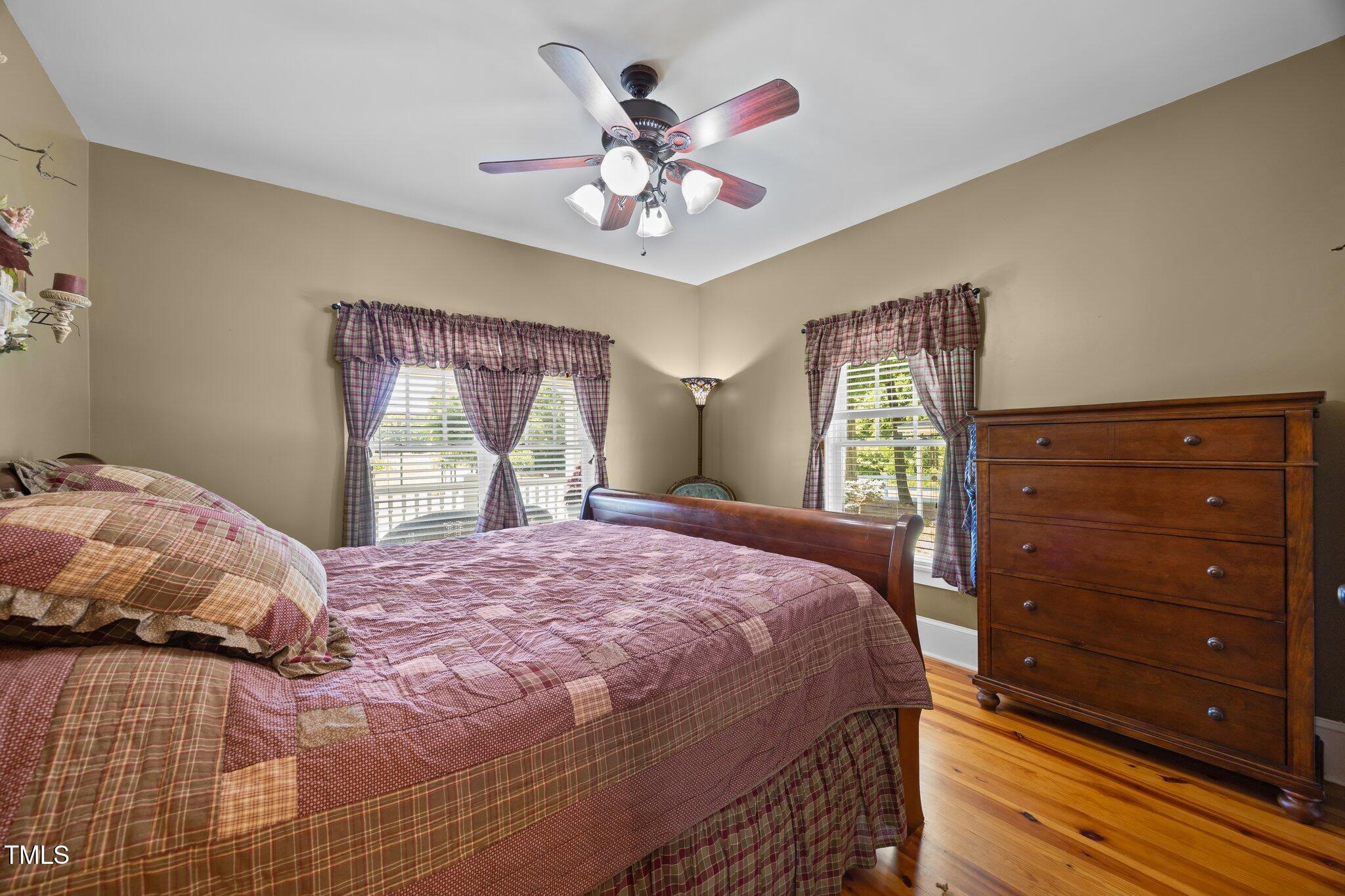 4050 Culbreth Road Stem, NC 27581 - Photo 24 of 46 a bedroom with a large bed and a window