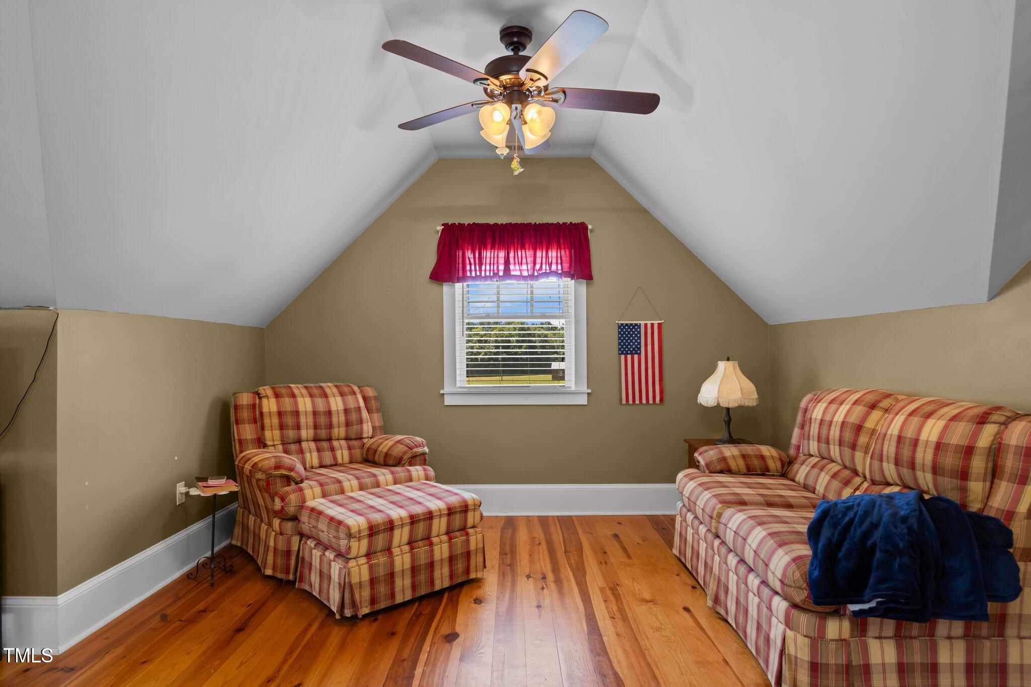 4050 Culbreth Road Stem, NC 27581 - Photo 31 of 46 a living room with furniture and a chandelier