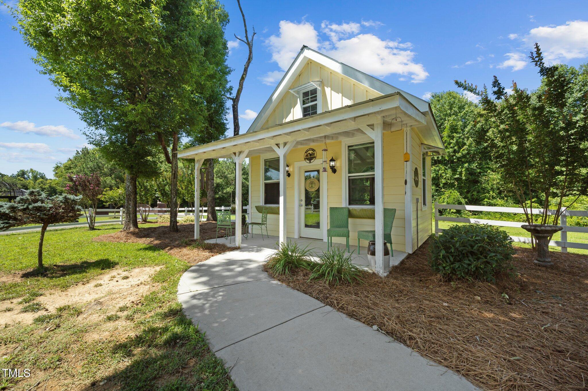 4050 Culbreth Road Stem, NC 27581 - Photo 35 of 46 a view of a house with backyard and garden