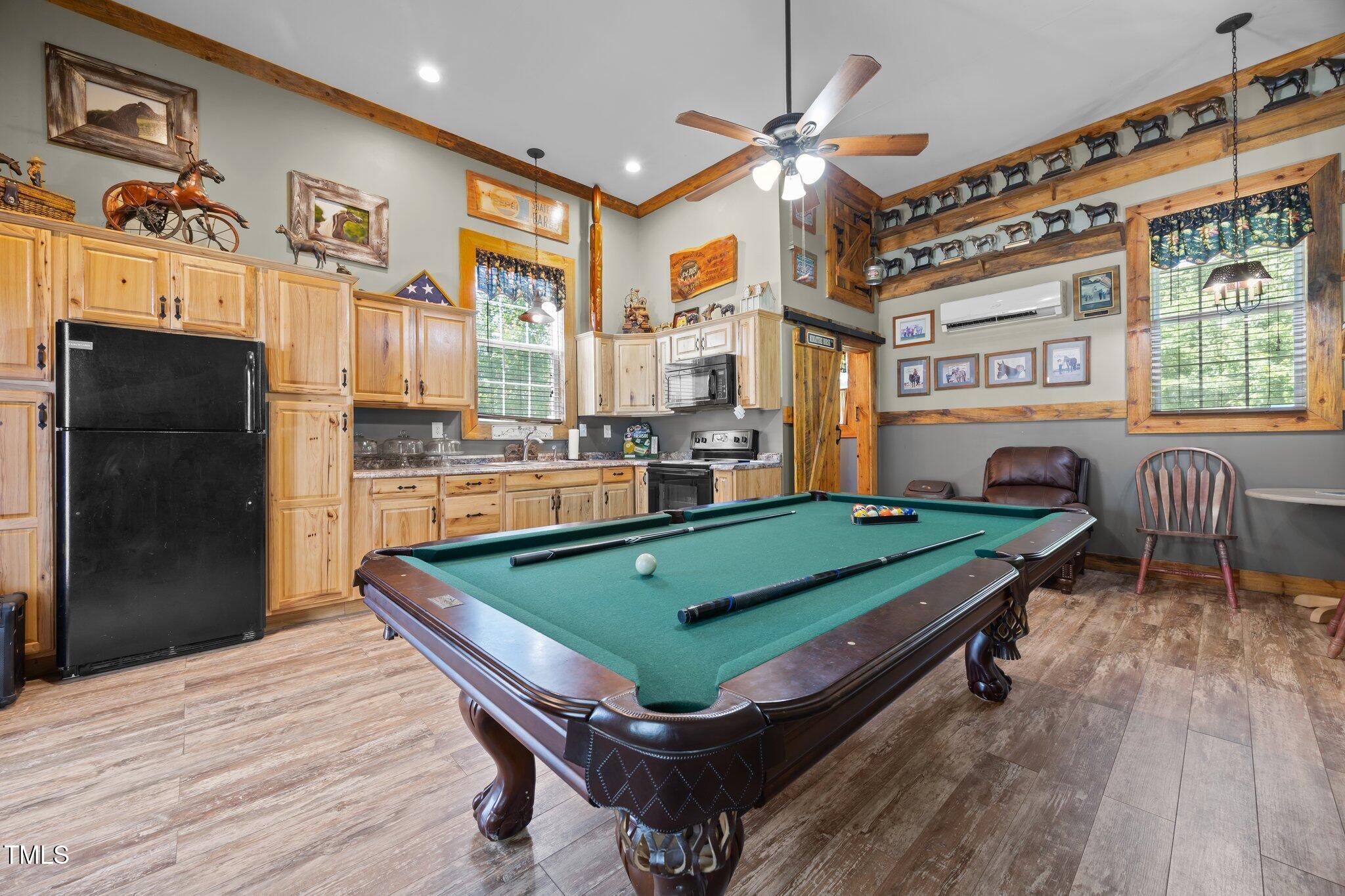 4050 Culbreth Road Stem, NC 27581 - Photo 38 of 46 a room with pool table and windows