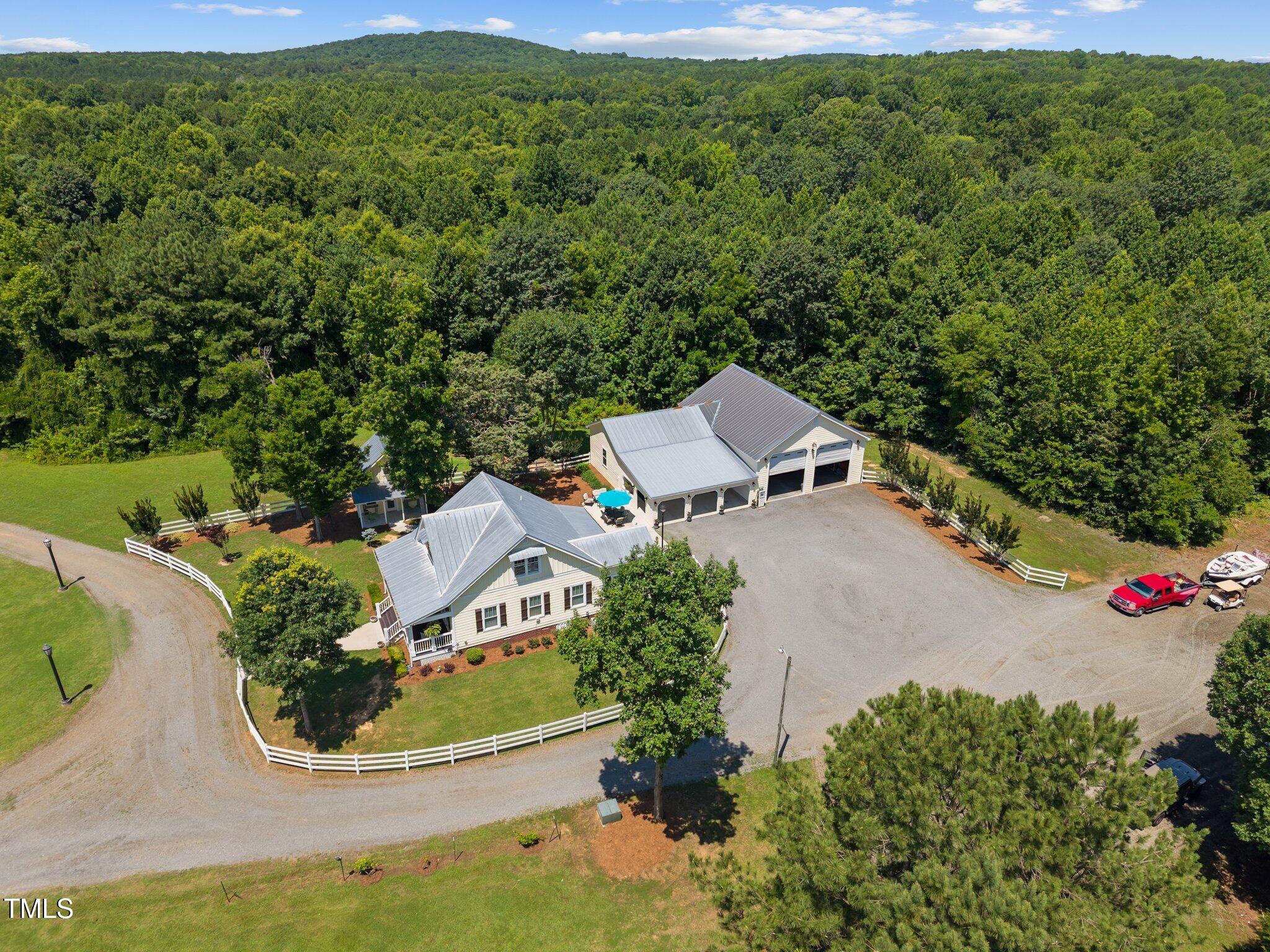 4050 Culbreth Road Stem, NC 27581 - Photo 4 of 46 an aerial view of a house with garden space and street view