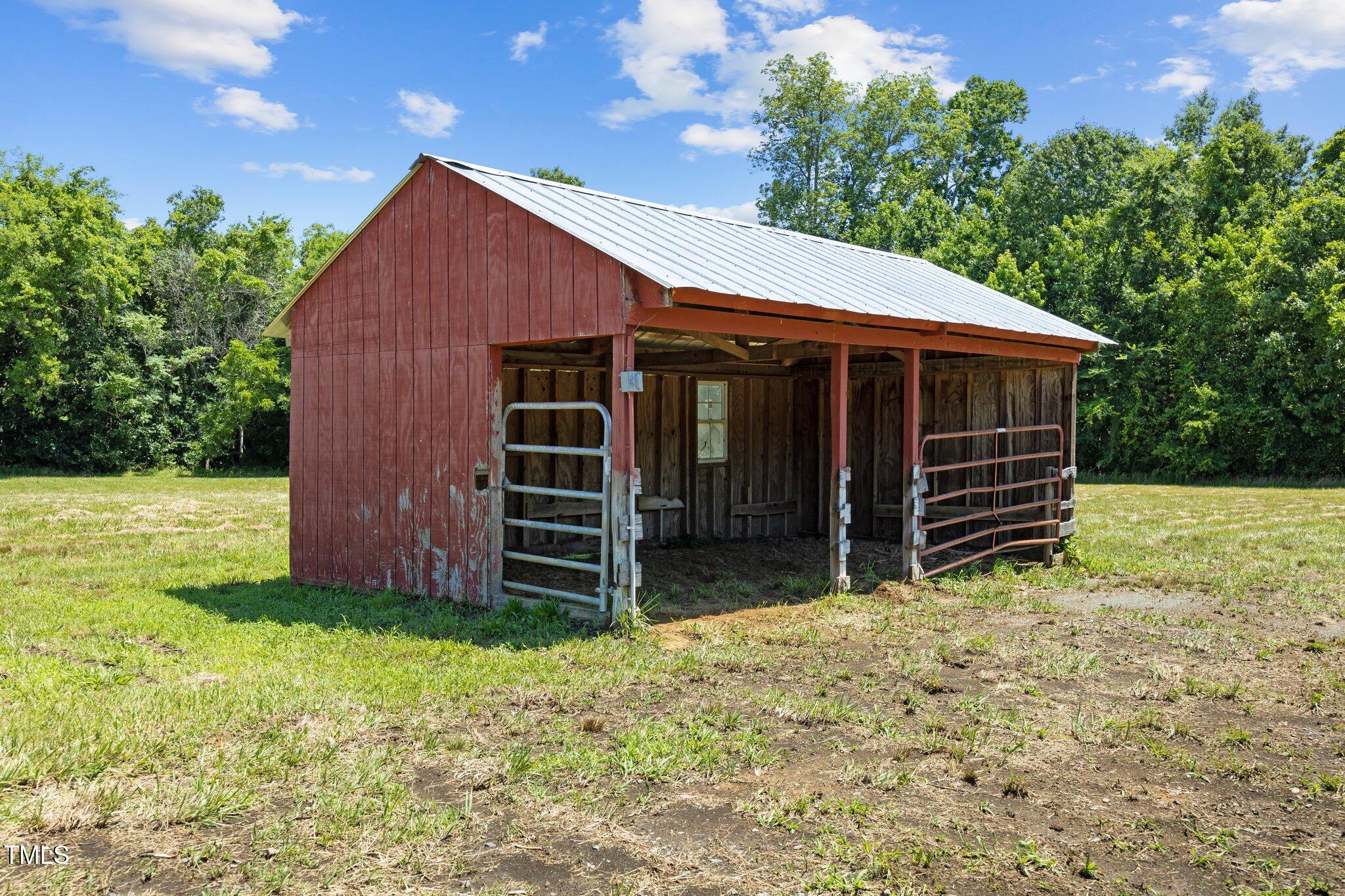4050 Culbreth Road Stem, NC 27581 - Photo 46 of 46 a view of house with backyard and tub
