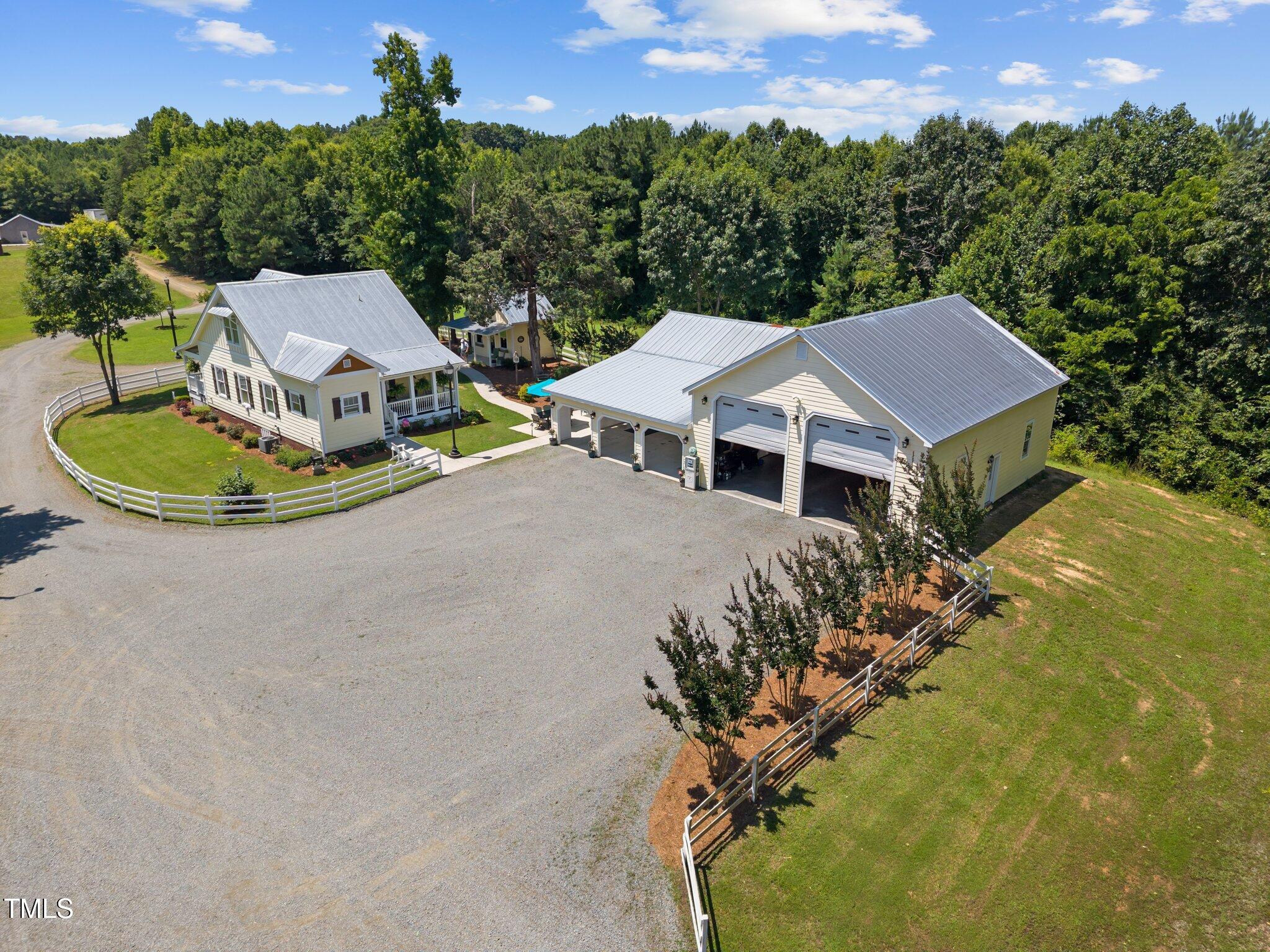 4050 Culbreth Road Stem, NC 27581 - Photo 8 of 46 a view of a house with a yard and sitting area