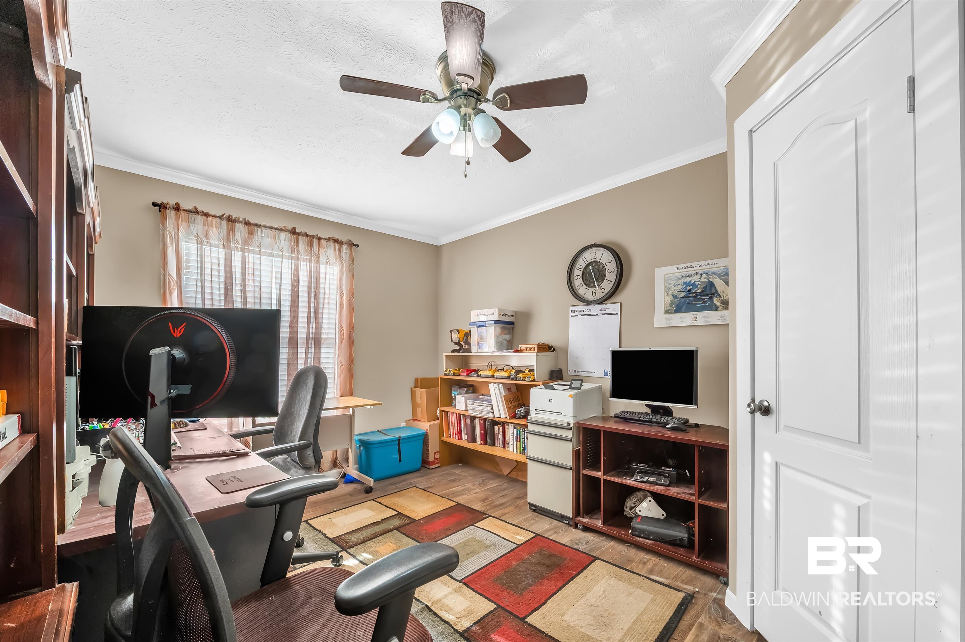 23233 Forland Road Silverhill, AL 36576 - Photo 29 of 33 Office space featuring wood finished floors, ceiling fan, and ornamental molding