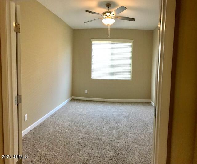 13655 West Briles Road Peoria, AZ 85383 - Photo 11 of 20 a view of an empty room with a window