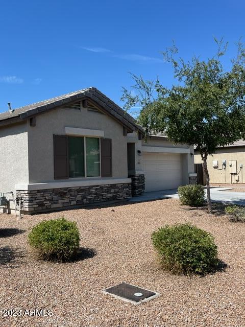 13655 West Briles Road Peoria, AZ 85383 - Photo 4 of 20 a front view of a house with a yard
