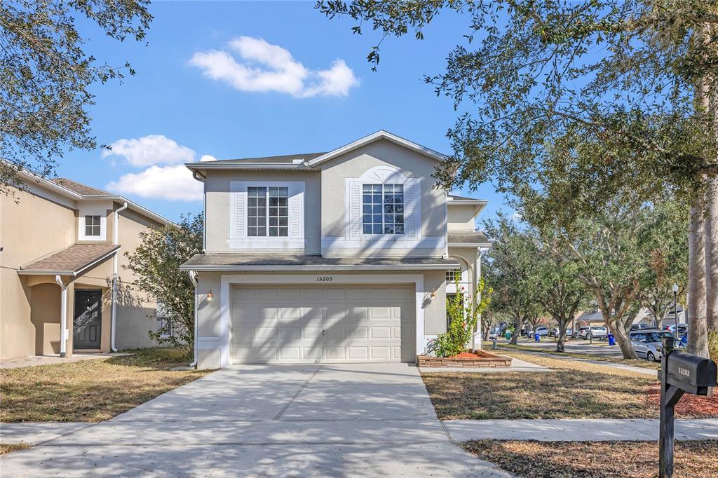 15203 Starleigh Road Winter Garden, FL 34787 - Photo 1 of 1 a front view of a house with a yard and garage