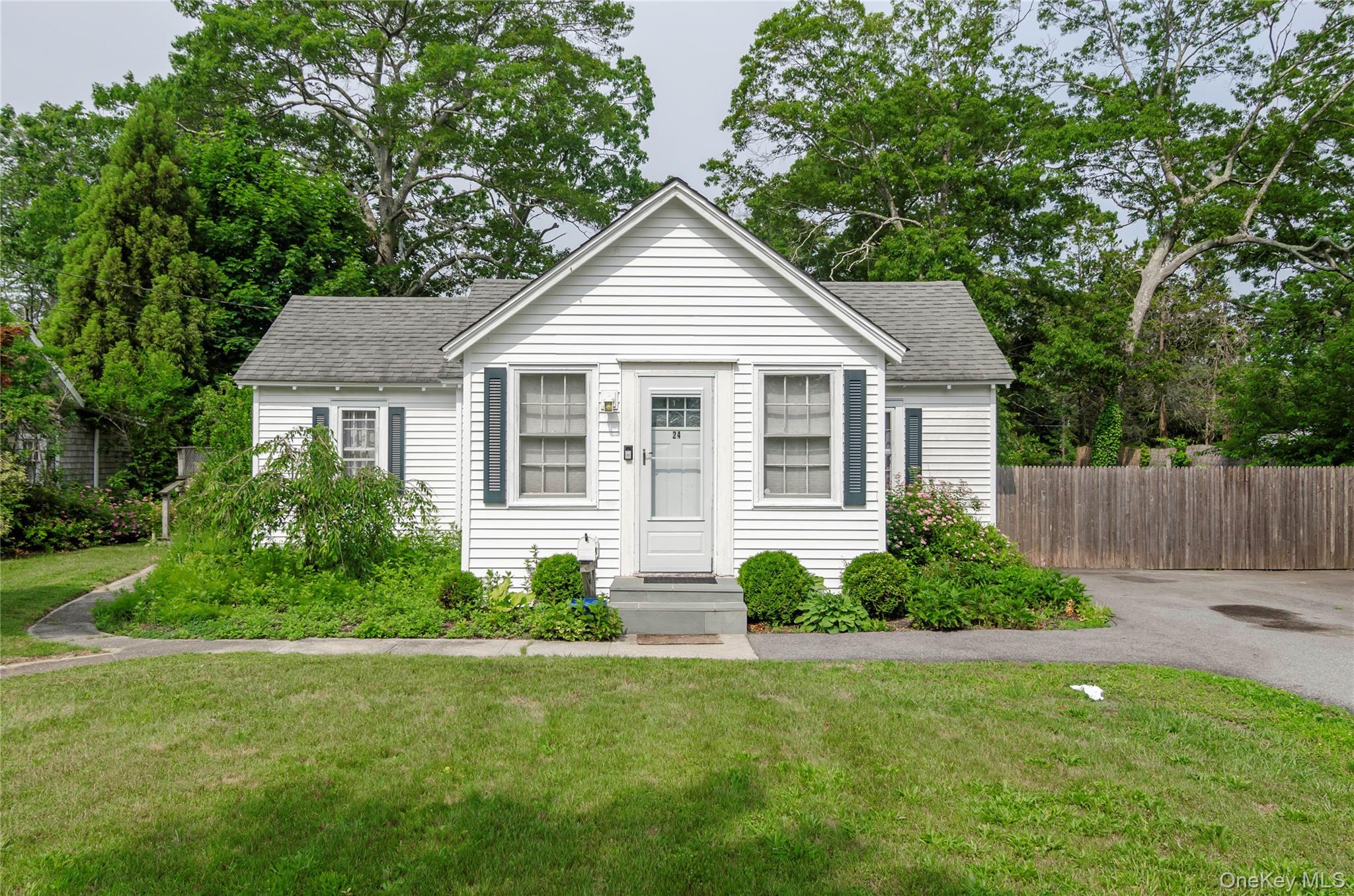 24 Circuit Road Bellport, NY 11713 - Photo 1 of 1 a view of a house with backyard and garden