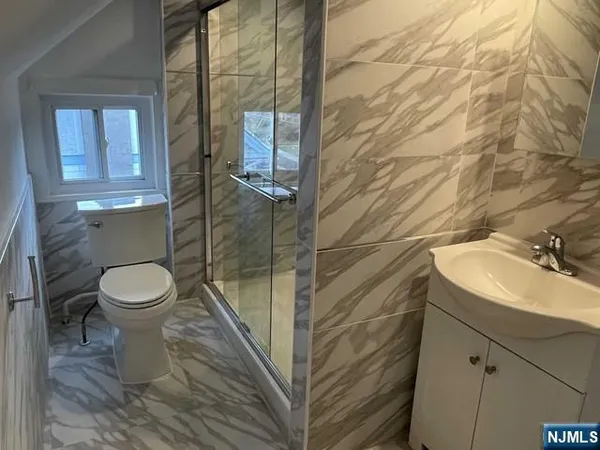 a bathroom with a toilet and a sink