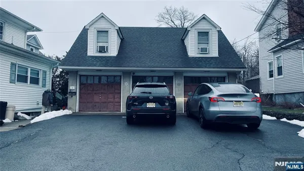 a car parked in front of a house