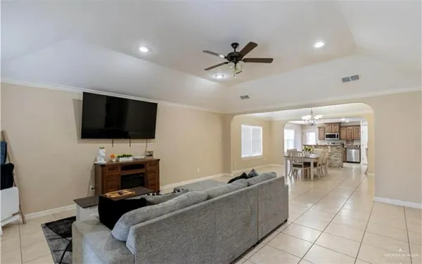 a living room with furniture and a flat screen tv