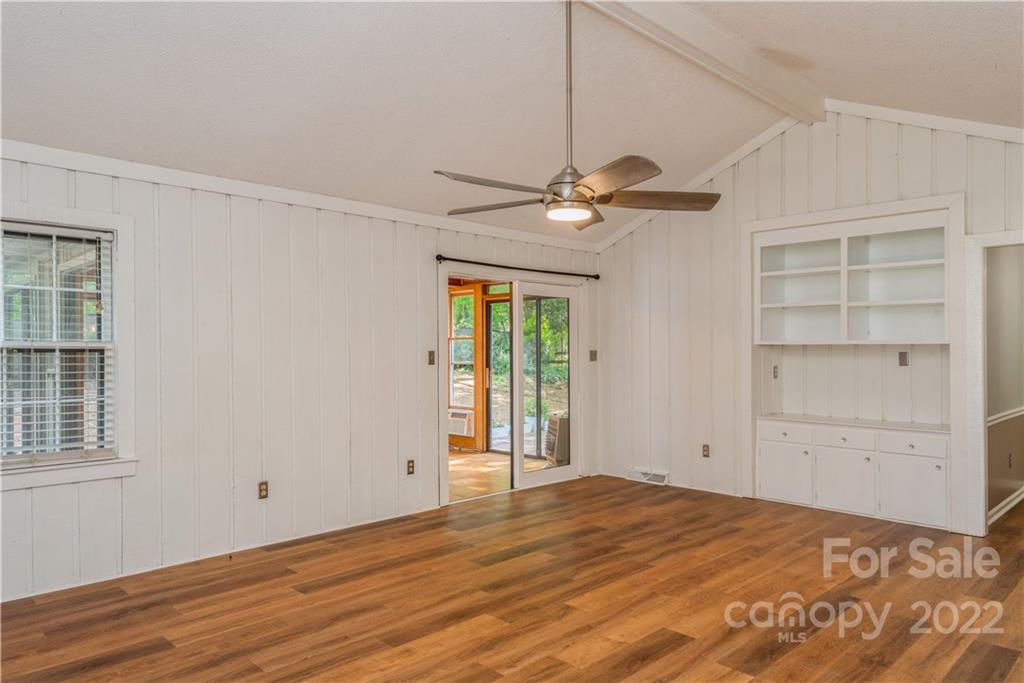 7607 Alexander Road Charlotte, NC 28270 - Photo 8 of 34 an empty room with wooden floor closet and windows