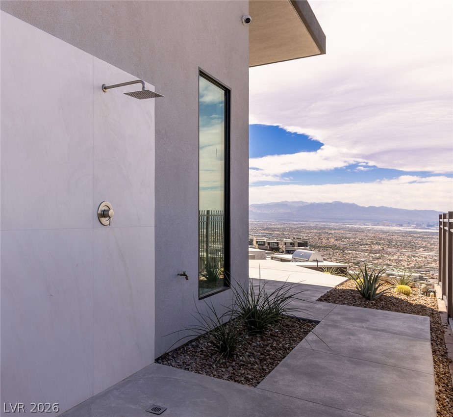 563 Grand Rim Drive Henderson, NV 89012 - Photo 66 of 70 An outdoor shower and modern architecture seamlessly integrate with breathtaking mountain and city panoramas.