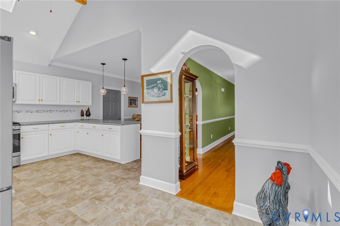 273 Sutton Avenue Reedville, VA 22539 - Photo 11 of 50 a kitchen with cabinets and window