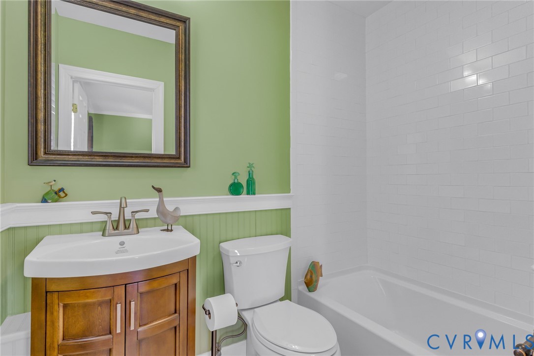 273 Sutton Avenue Reedville, VA 22539 - Photo 20 of 50 a bathroom with a sink a toilet and mirror